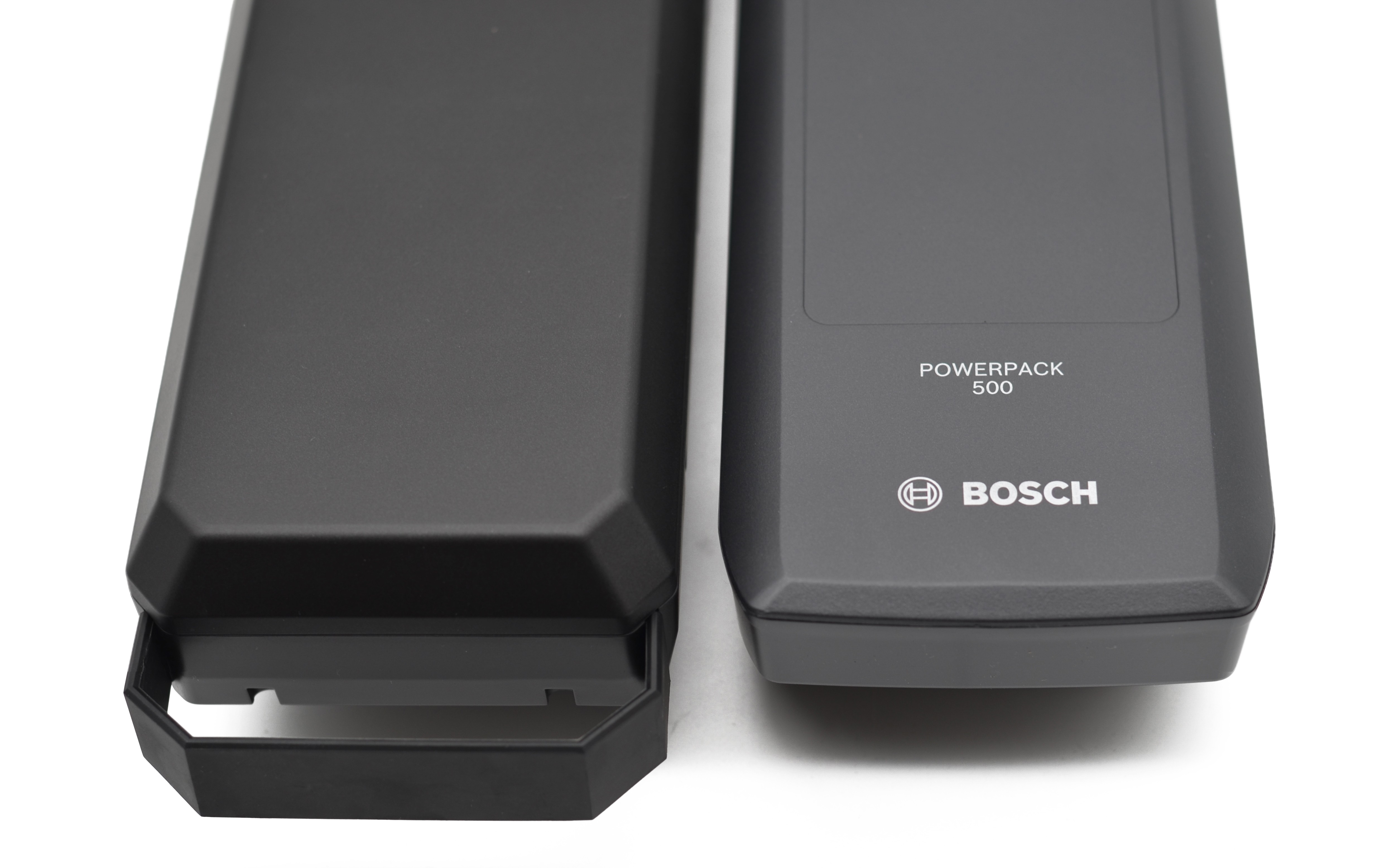 een originele fietsaccu naast een compatibel fietsaccu